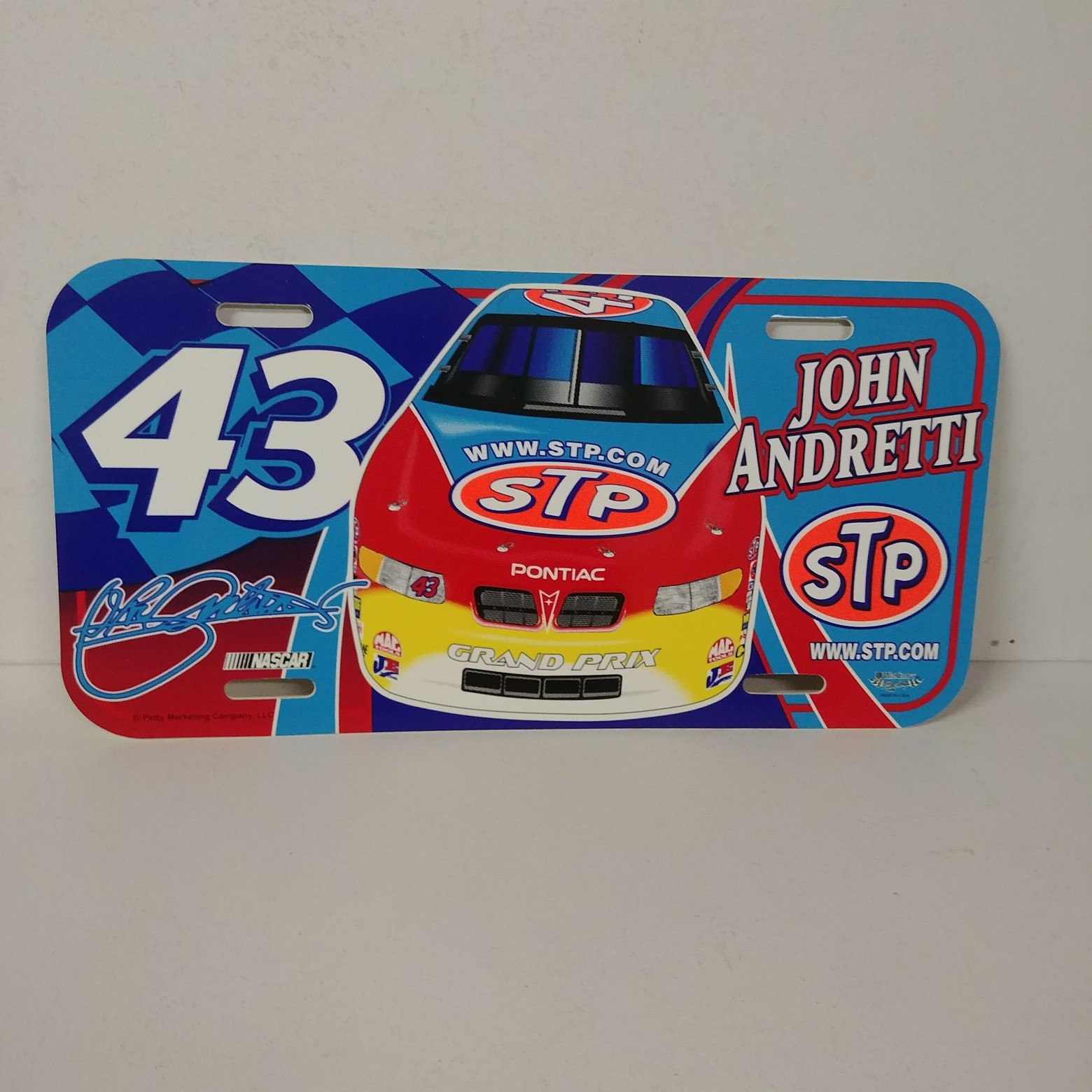 1999 John Andretti STP plastic license plate